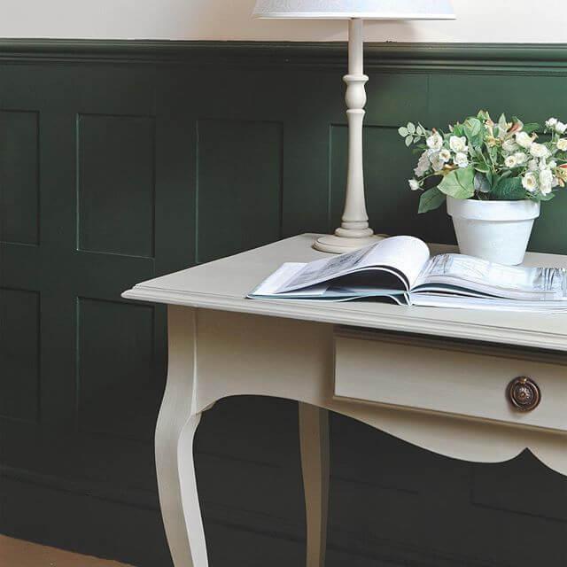 Victorian wall panelling in a study. Panelling is painted green.