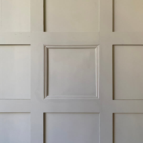 MDF Wall Panelling with bead moulding. Painted in grey.